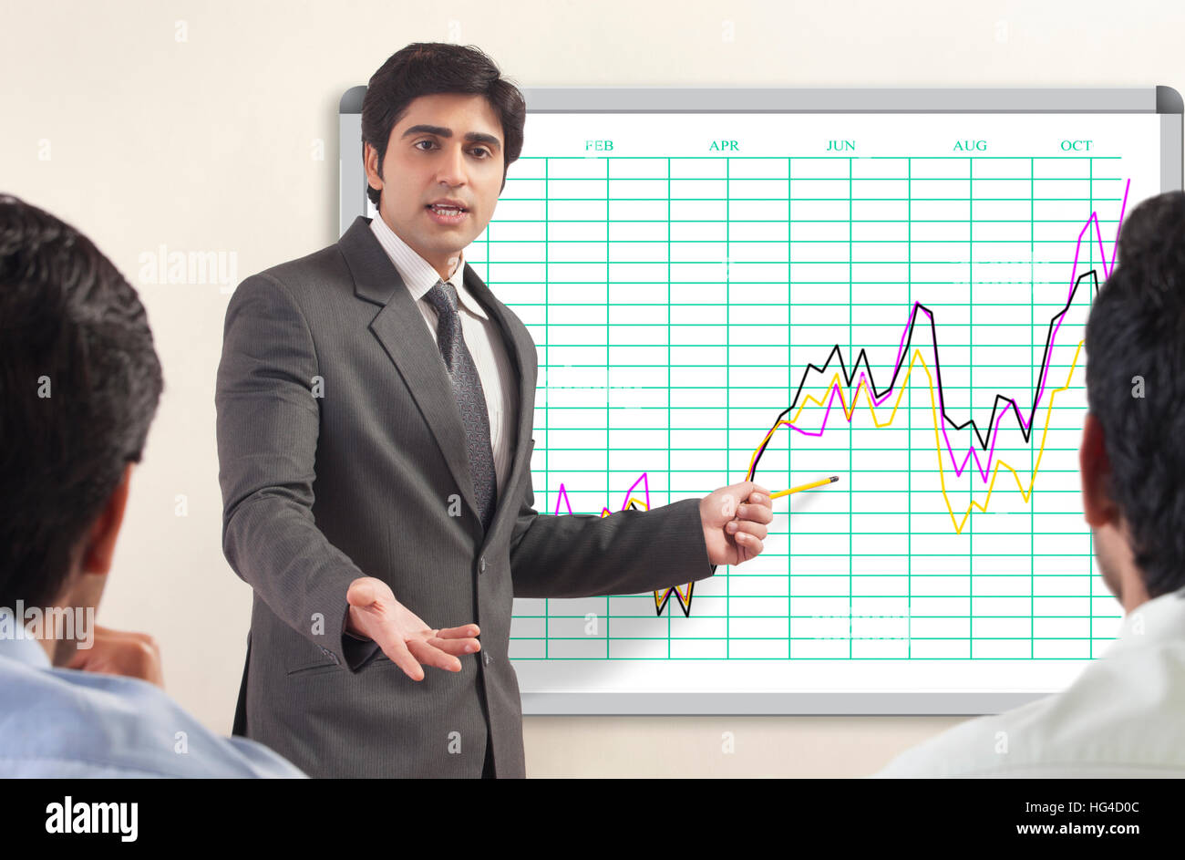 Businessman presenting to colleagues Stock Photo