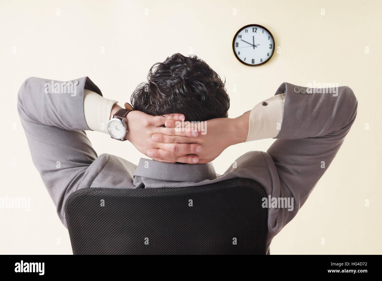 Man watching clock wall hi-res stock photography and images - Alamy