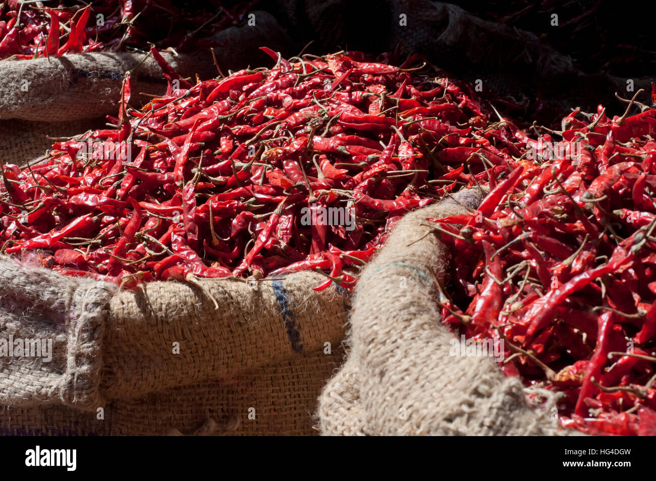 Red dried chili peppers for sale at market, India Stock Photo - Alamy