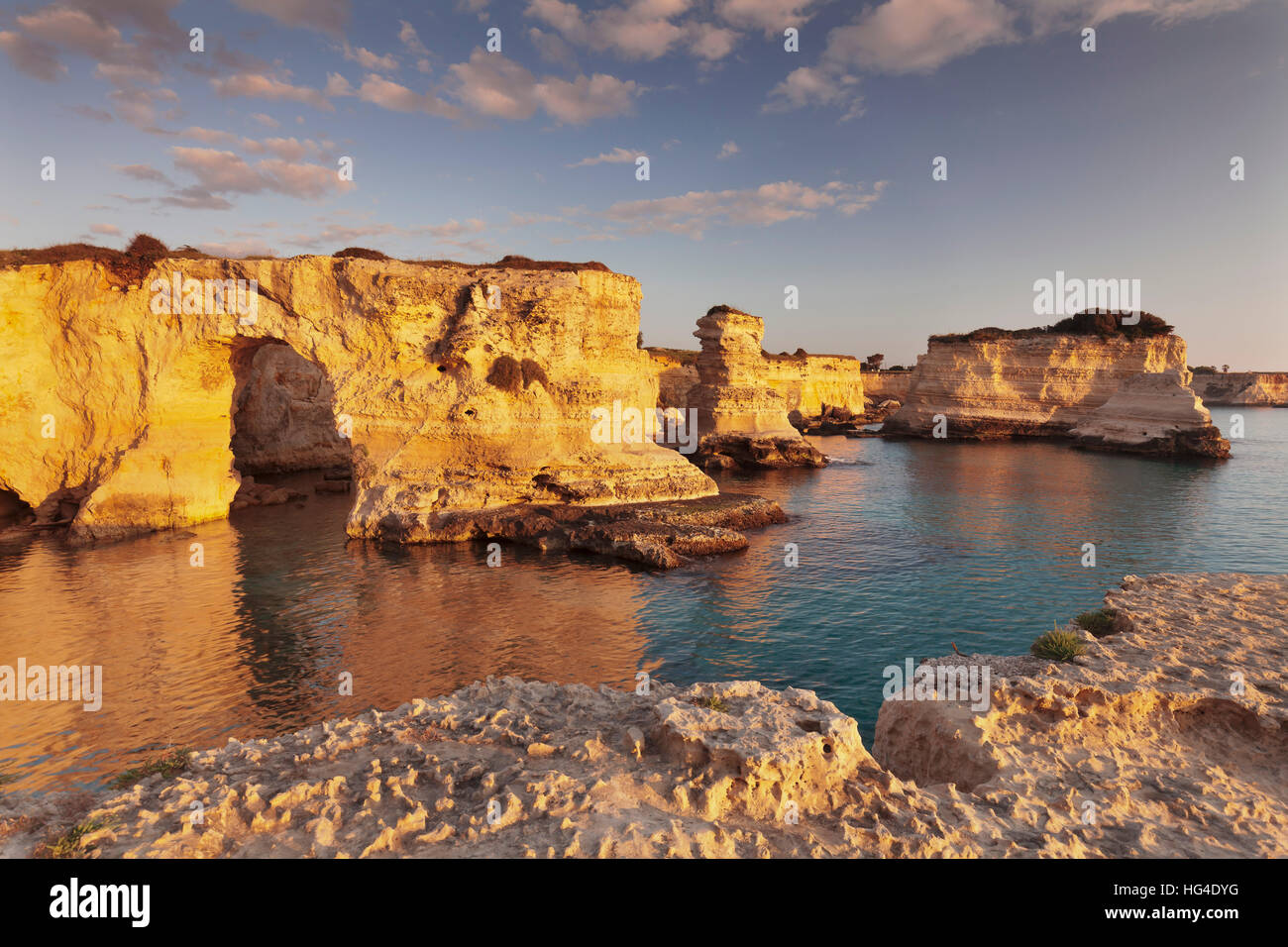Rocky columns, natural monument, rocky coast at sunrise , Sant'Andrea, Adriatic Sea, Salentine Peninsula, Puglia, Italy Stock Photo