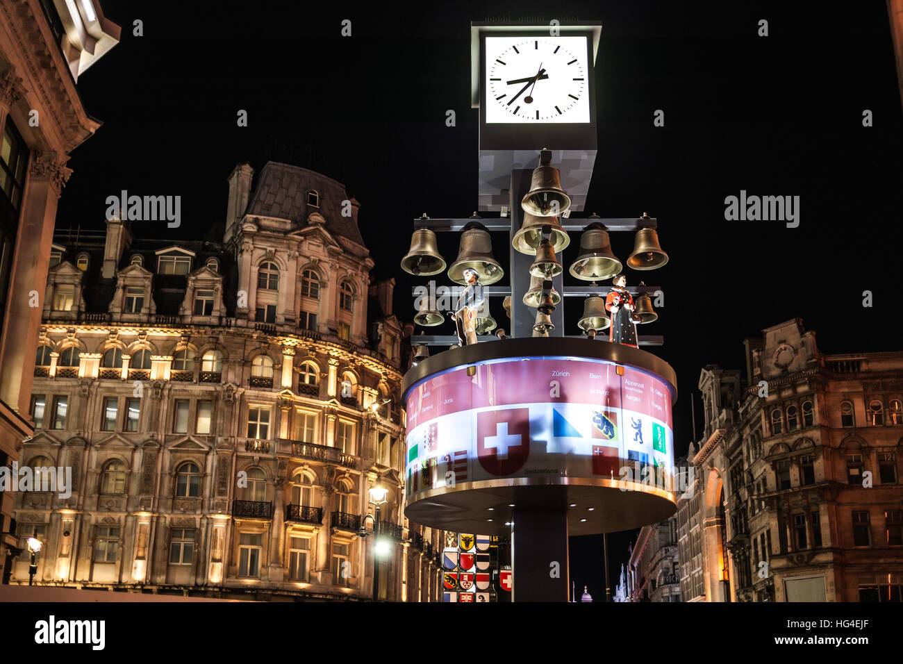 London UK, Swiss glockenspiel clock at night in Leicester Square Stock Photo