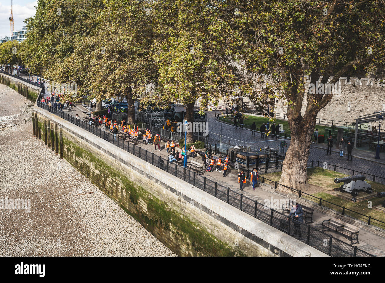 London, Group of little students walking in line across Thames river Stock Photo