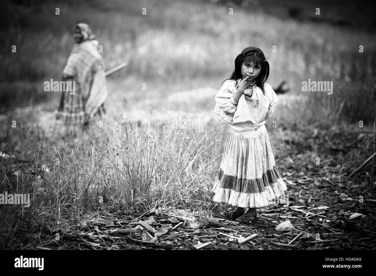 Little Mexican girl is intrigued by the camera Stock Photo