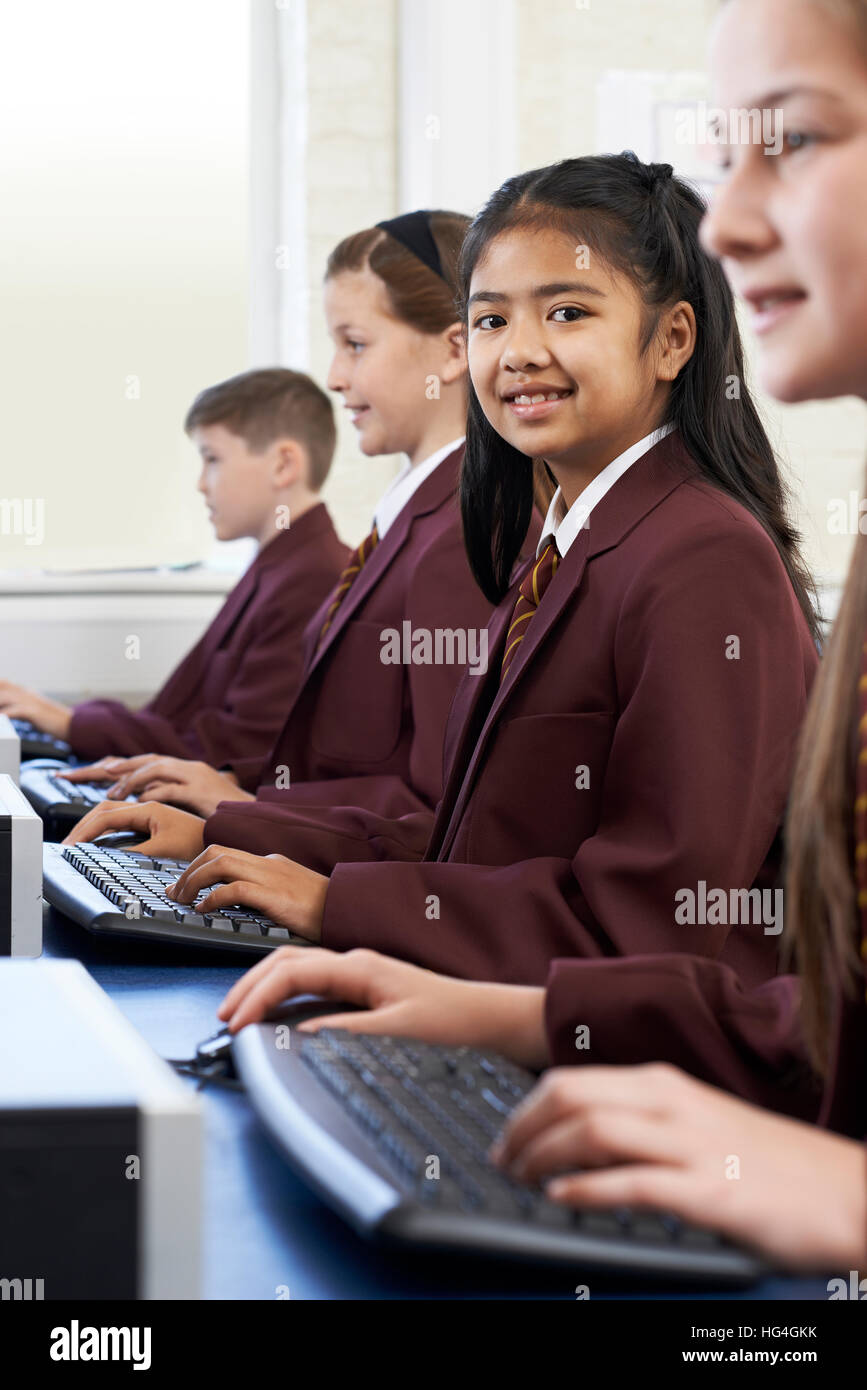 Pupils Wearing School Uniform In Computer Class Stock Photo - Alamy