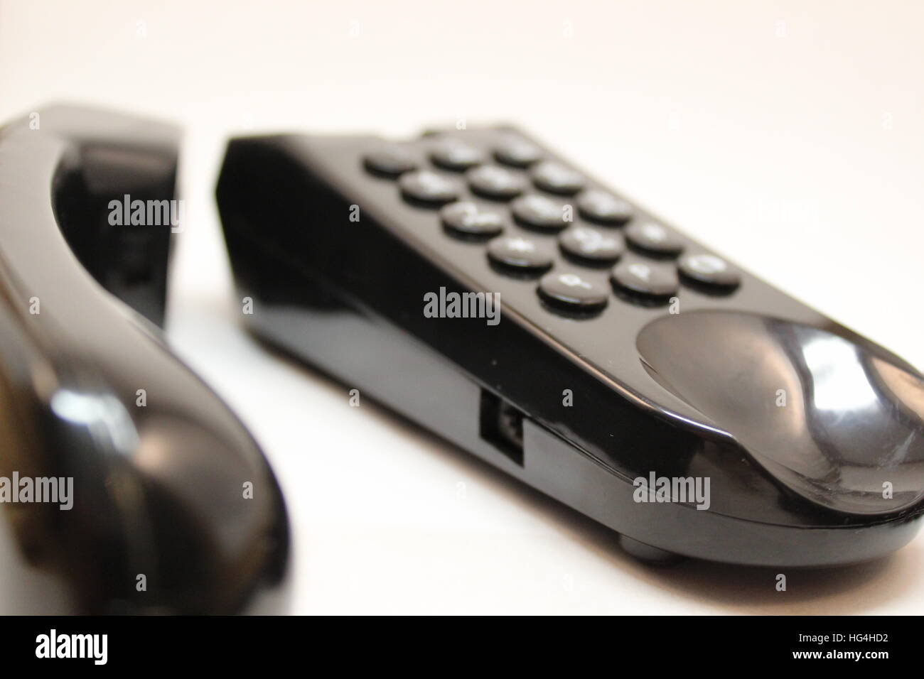 A black telephone on a white background Stock Photo
