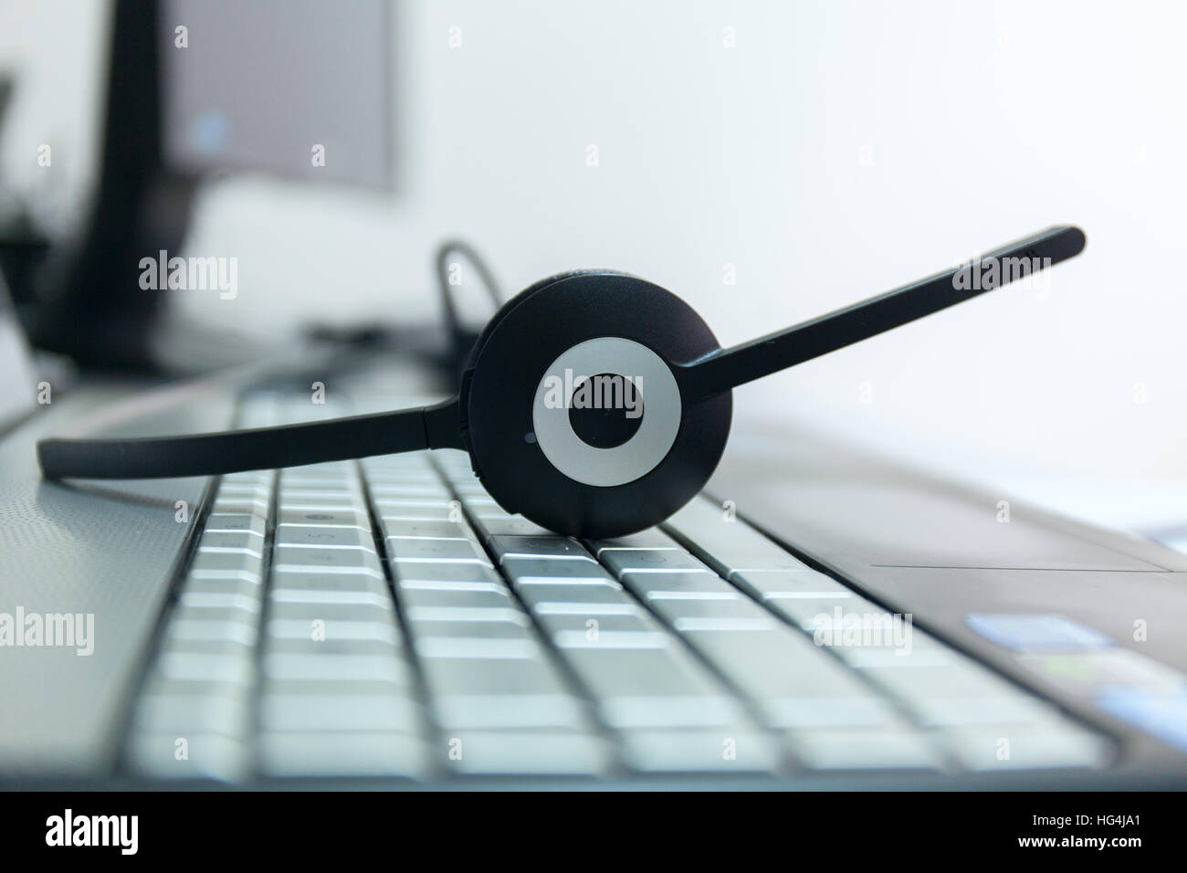 computer headphones on a keyboard of the notebook Stock Photo Alamy