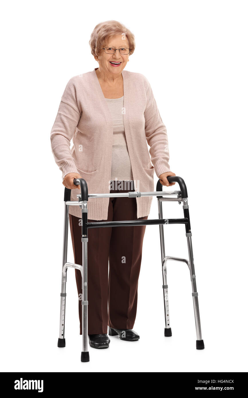 Full length portrait of a joyful mature woman with a walker isolated on white background Stock Photo