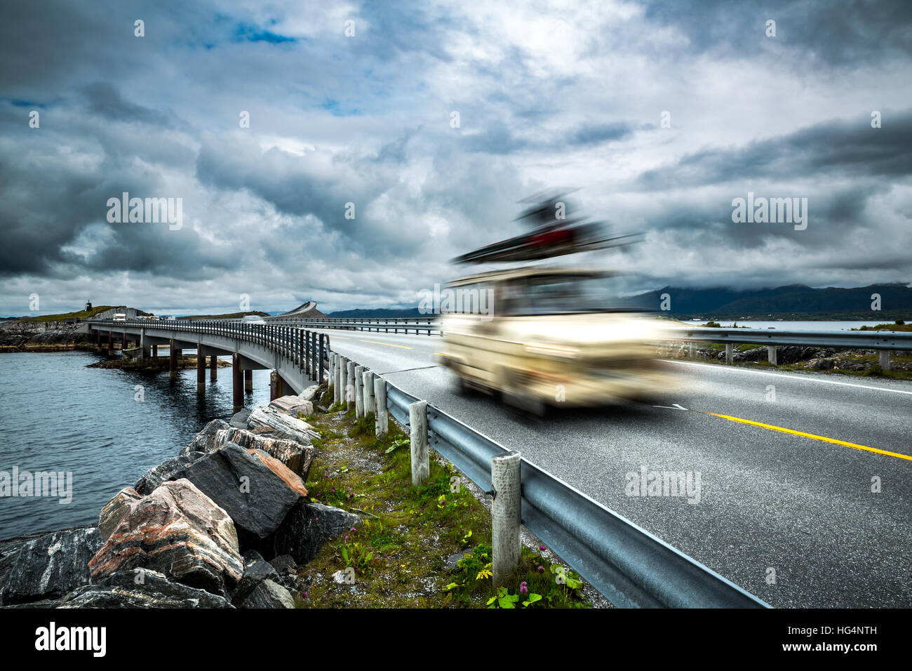 Car travels on the highway. Caravan Car in motion blur. Norway. Atlantic Ocean Road or the Atlantic Road (Atlanterhavsveien) been awarded the title as Stock Photo