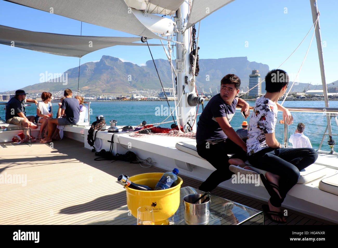 Cape Town. A luxury yacht with Asian tourists on board approaches Cape