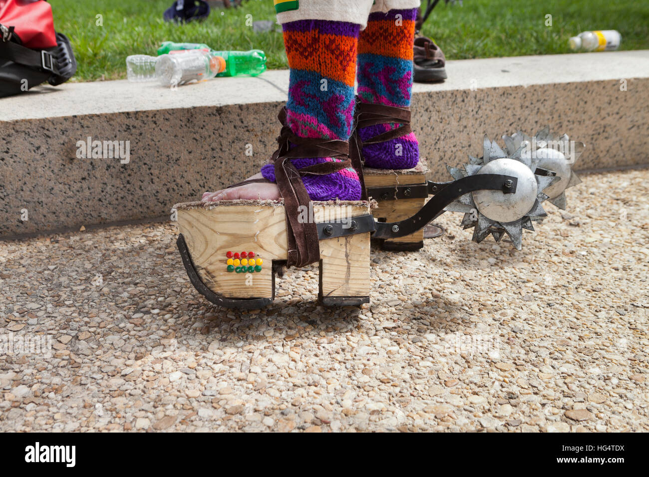 Wooden platform sandals and spurs on Pujllay dancer of the Quechuan people of Bolivia  - Washington, DC USA Stock Photo