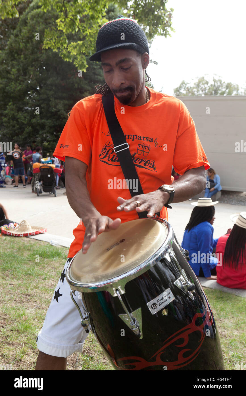 Afro-Caribbean conga drummer (tumbadora player) - USA Stock Photo