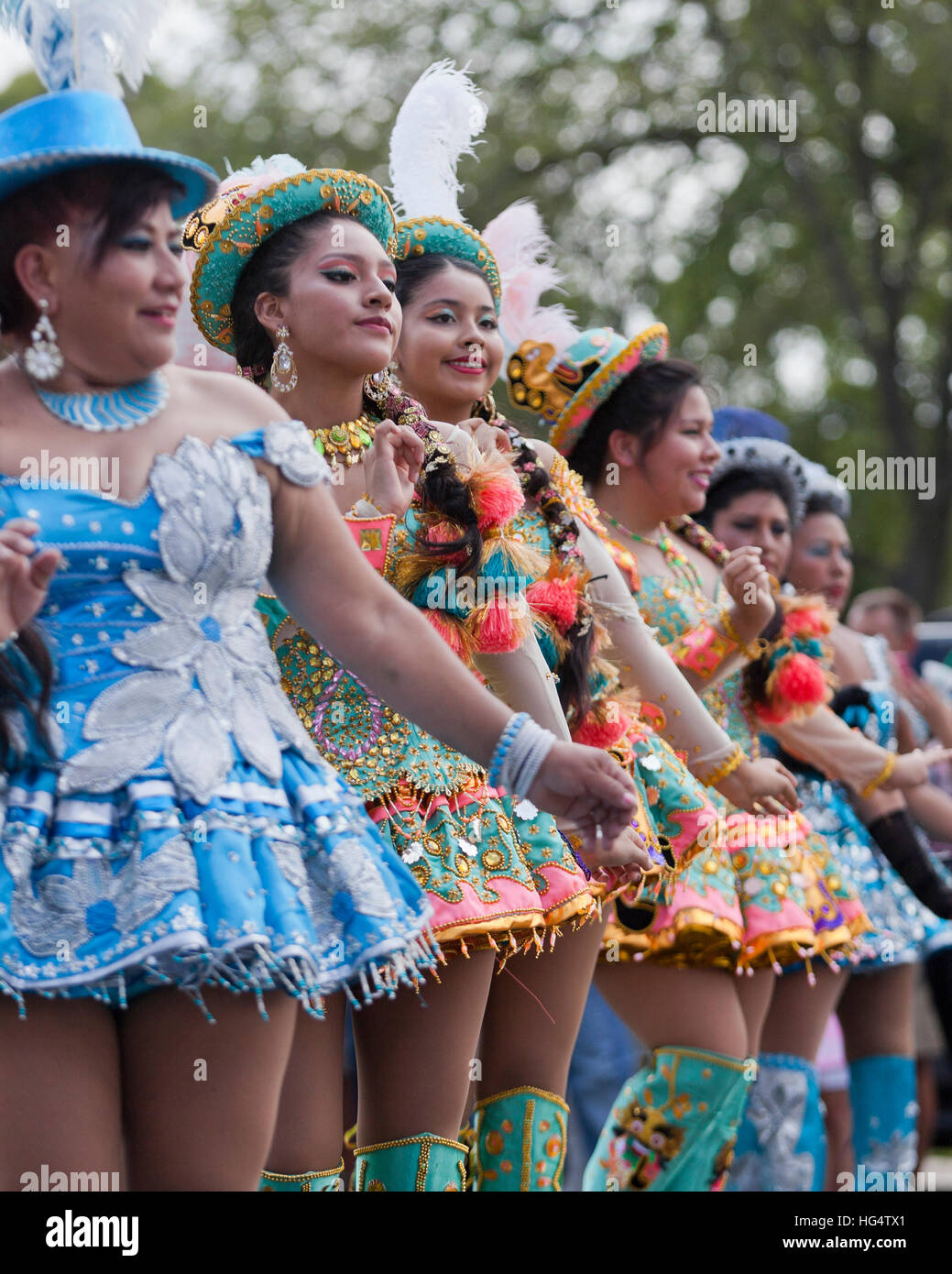 Young Female Traditional Bolivian Dancers In Costume At Latino Festival Young Female Traditional Bolivian Dancers In Costume At Latino Festival