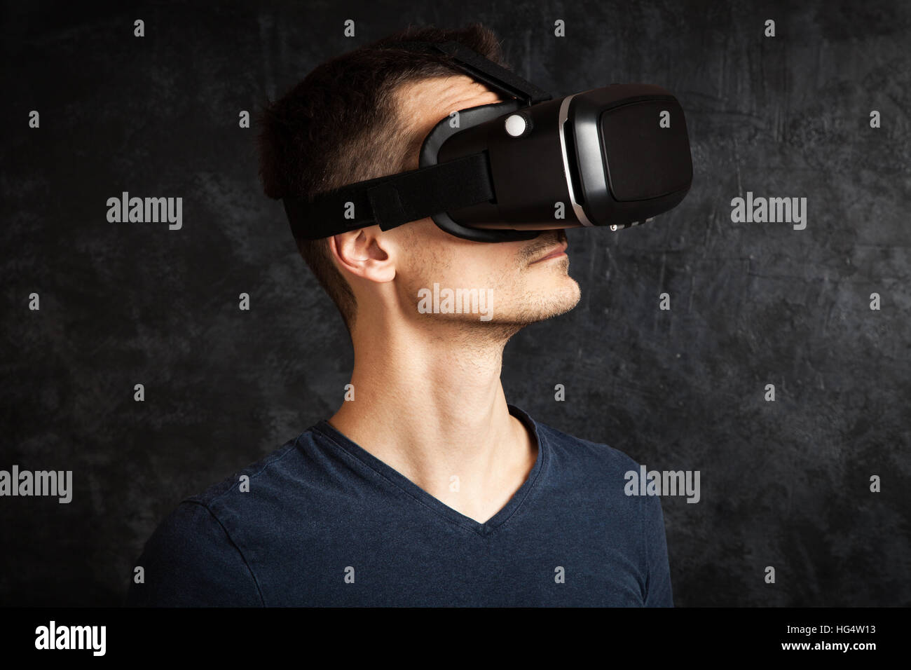 Man using virtual reality headset Stock Photo - Alamy