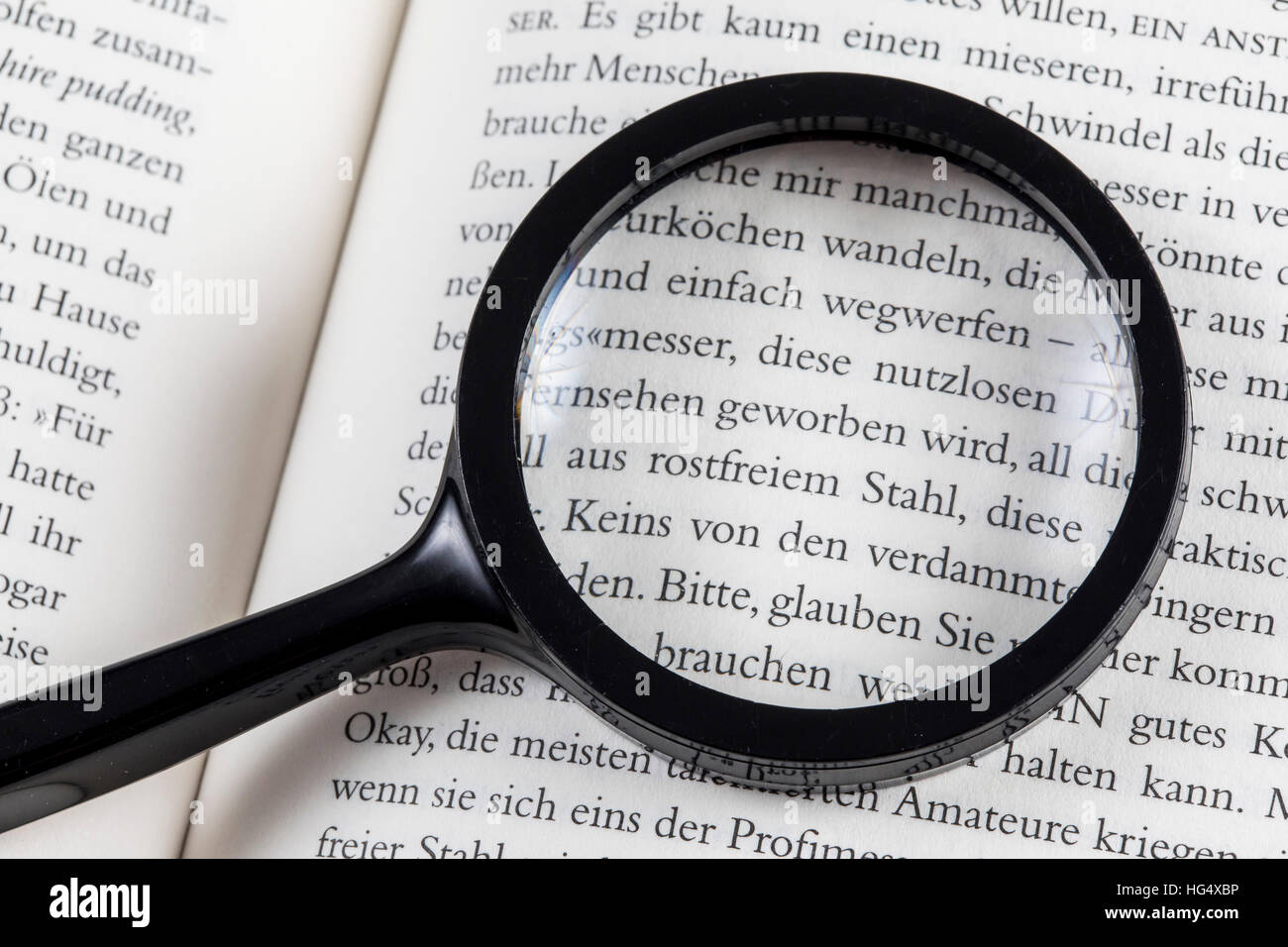 Reading aid, reading glasses, magnifying glass, loupe Stock Photo