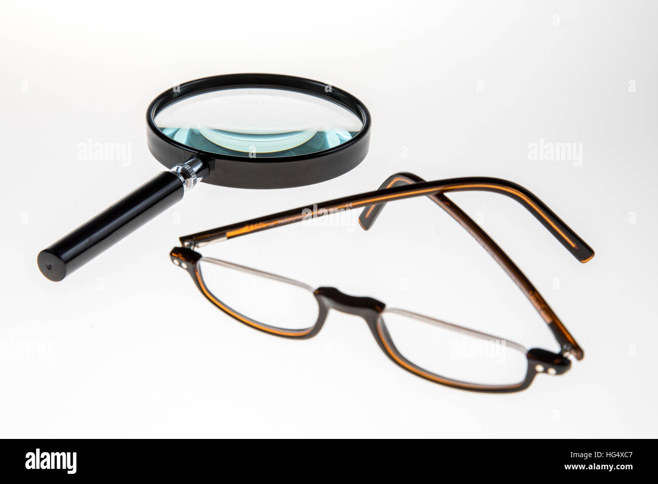 Reading aid, reading glasses, magnifying glass, loupe Stock Photo