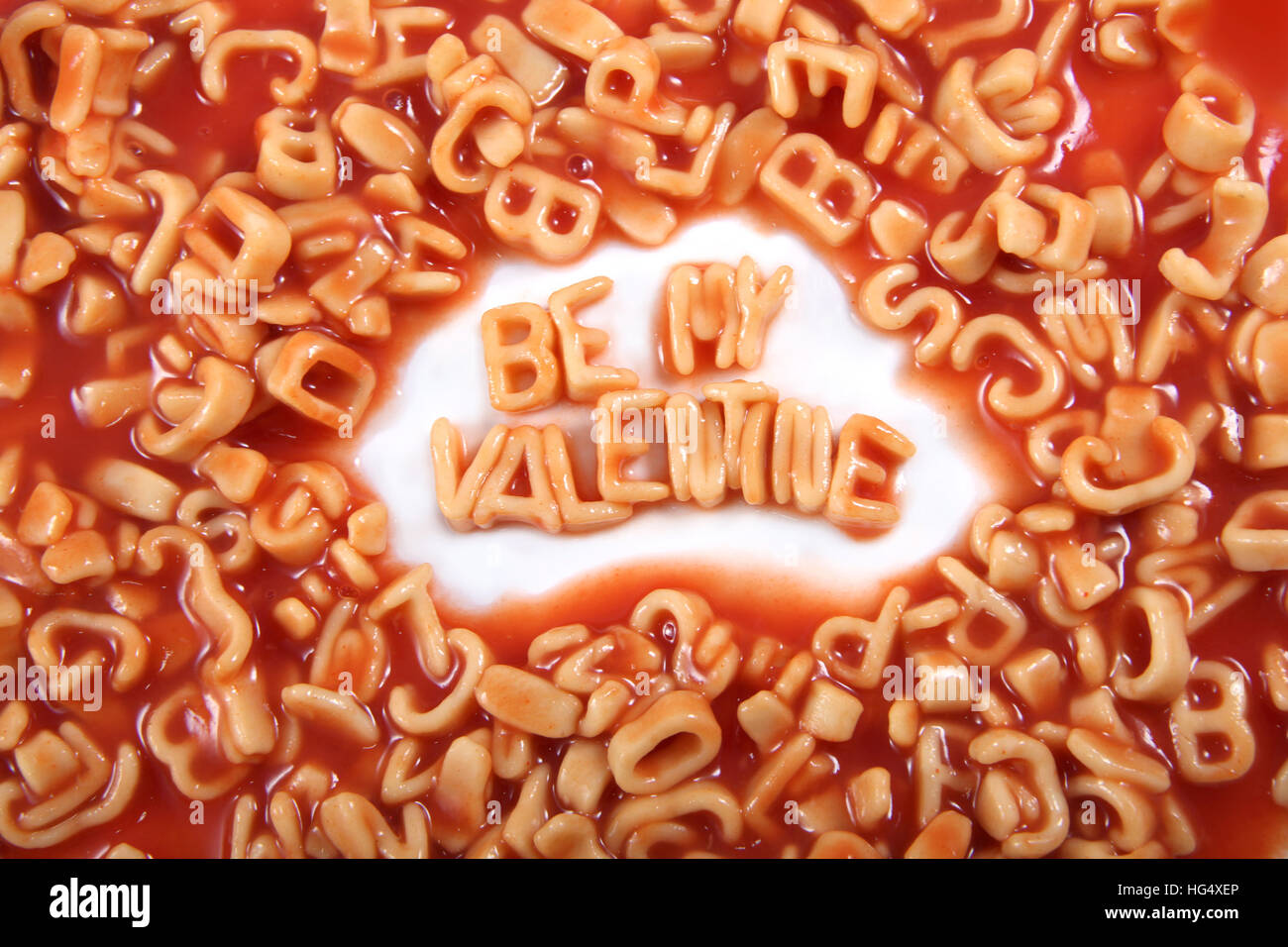 'Be my Valentine' written in spaghetti pasta letters for Valentines Day. Stock Photo