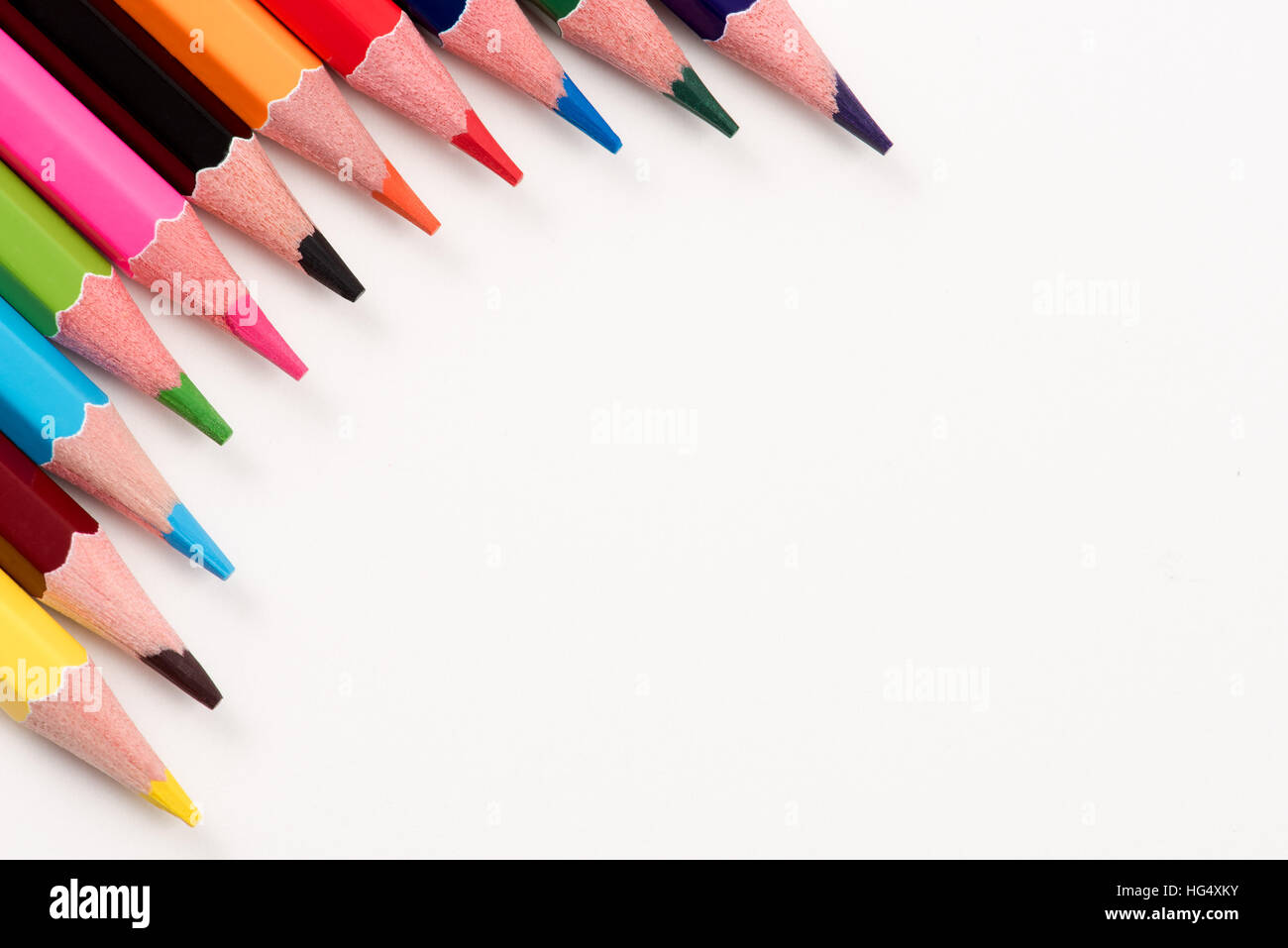 Colored pencils arranged on the table in natural light Stock Photo