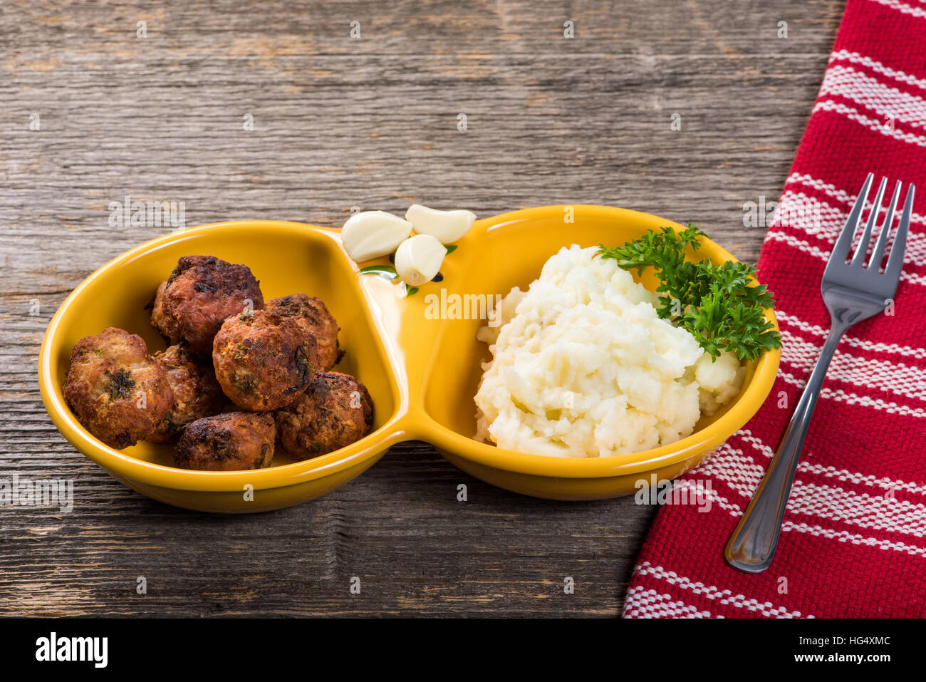 Meat patties with mashed potatoes on the table in natural light Stock Photo