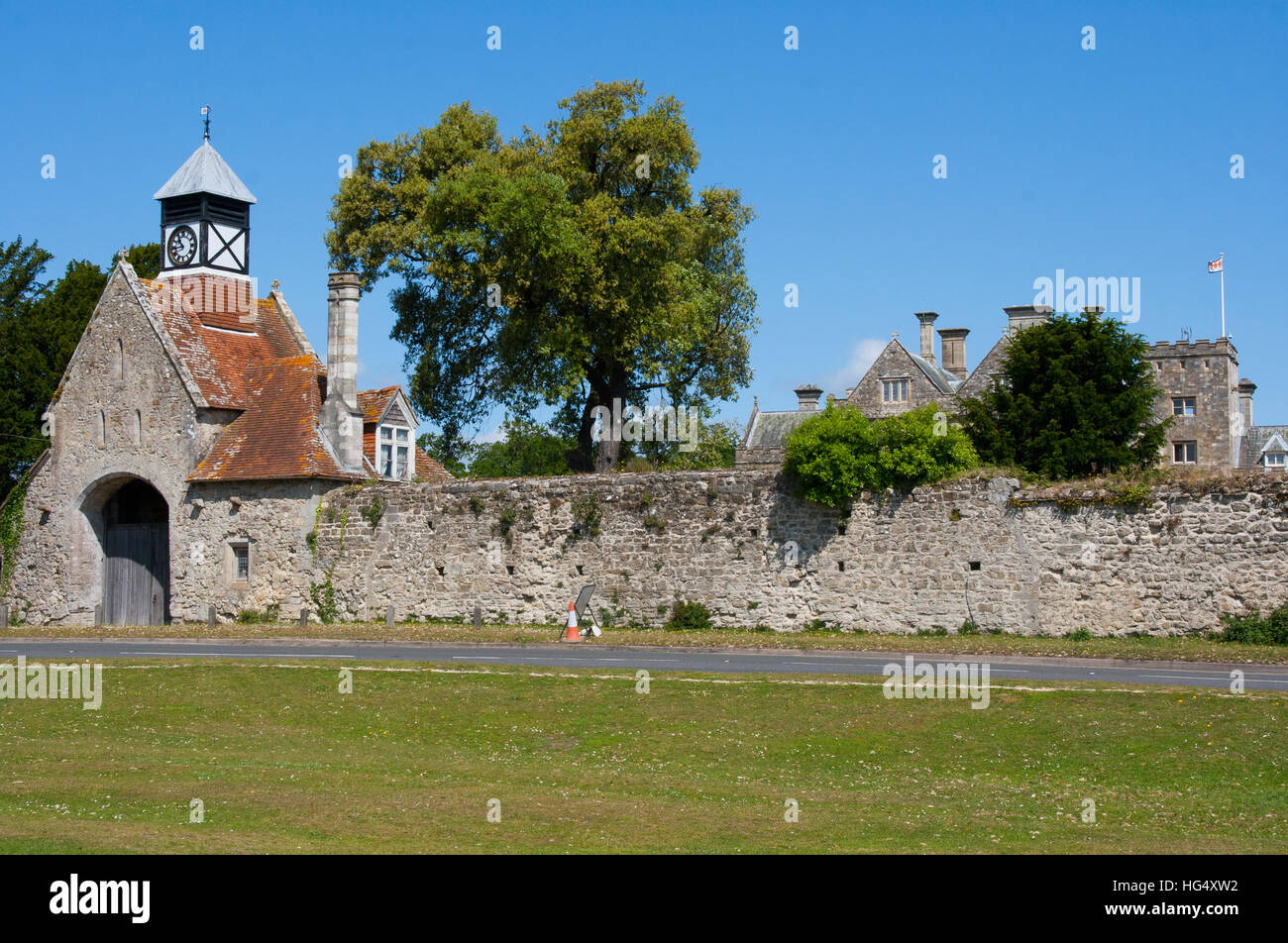 The ancient stone built gatehouse with Tudor style clock tower of