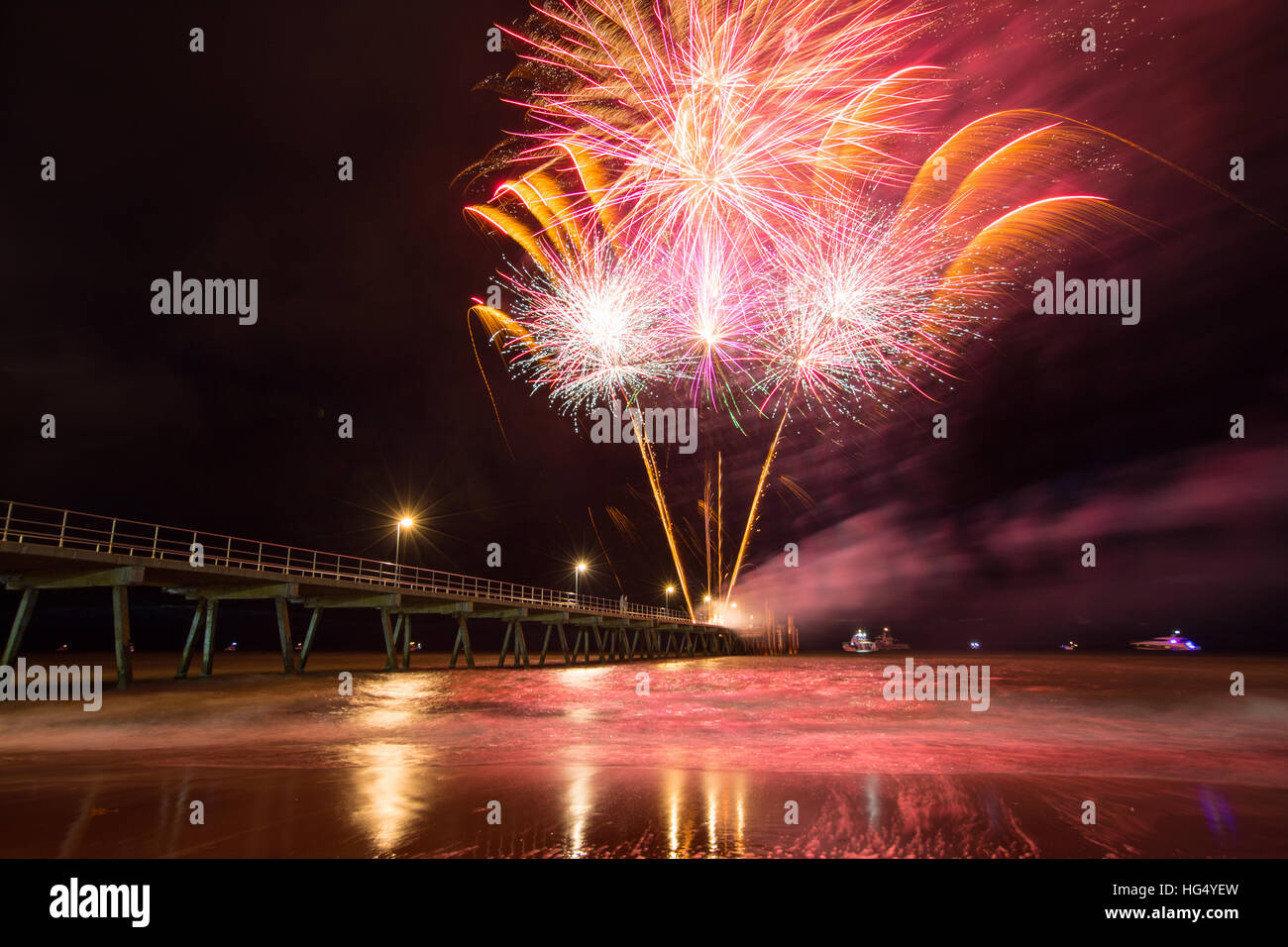 Colourful 2017 New Years Fireworks Display lighting up the sky and water off Glenelg Jetty
