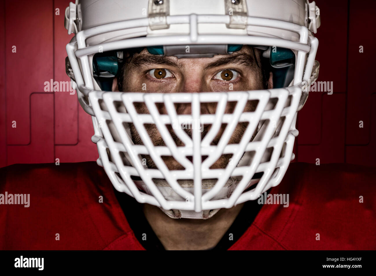 Close up in the eyes of a Football Player with a red uniform on a