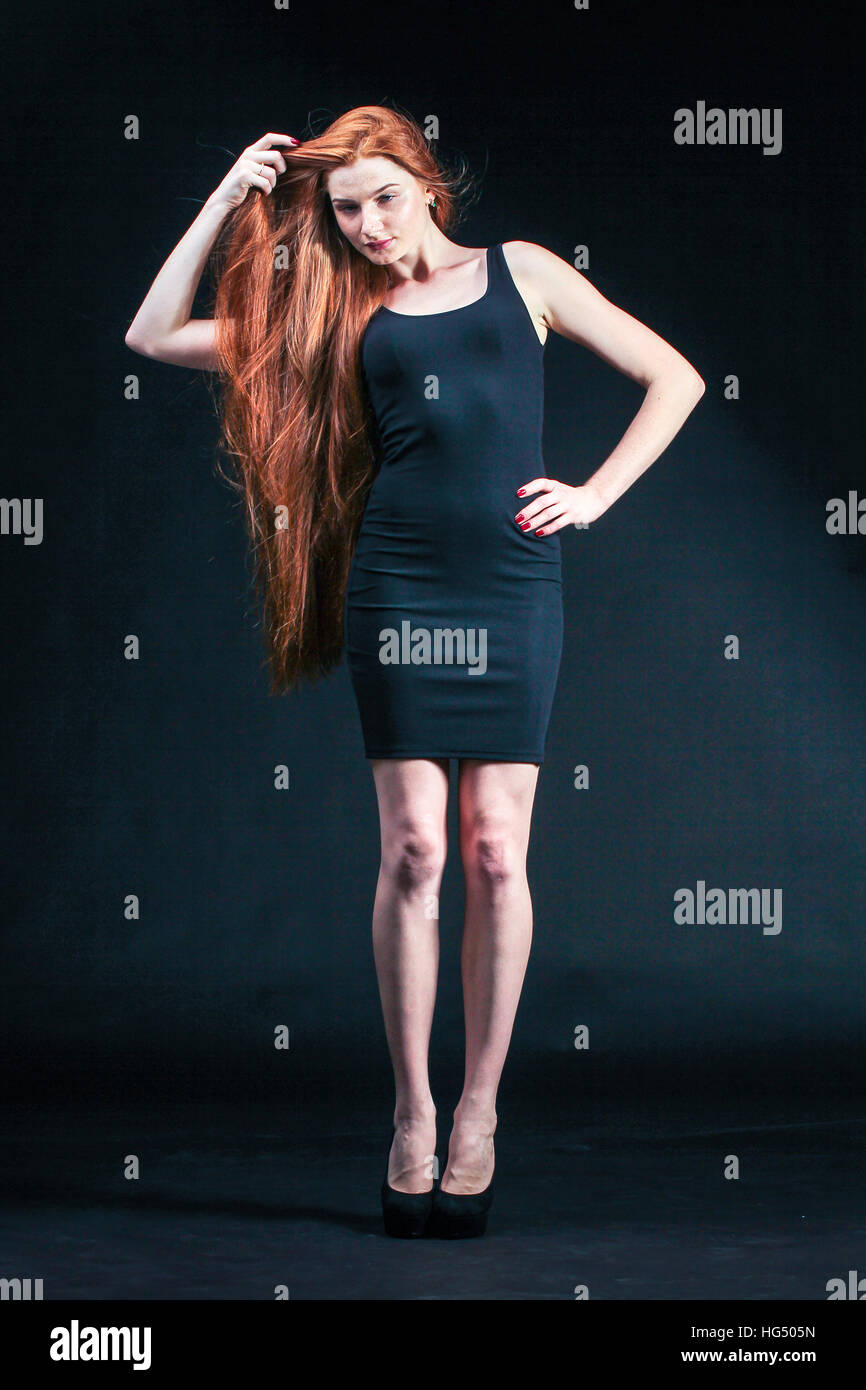 Beauty ginger Girl Portrait. Healthy Long Red Hair. Beautiful Young