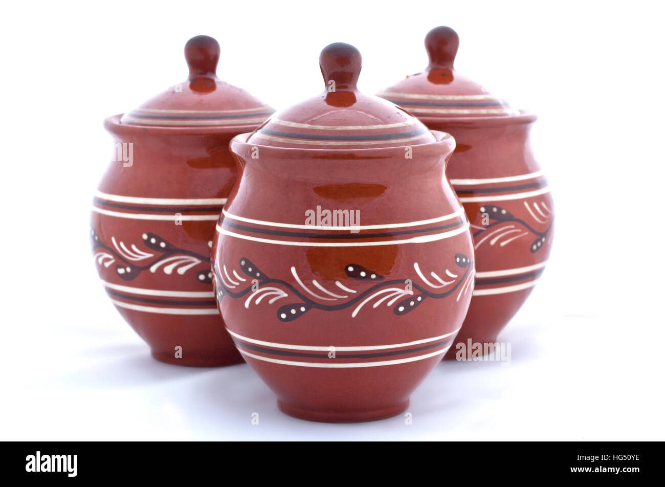 Three clay pots on a white background, isolated Stock Photo - Alamy
