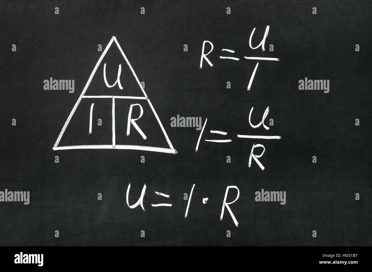 Ohm's Law triangle drawn on a blackboard with chalk Stock Photo