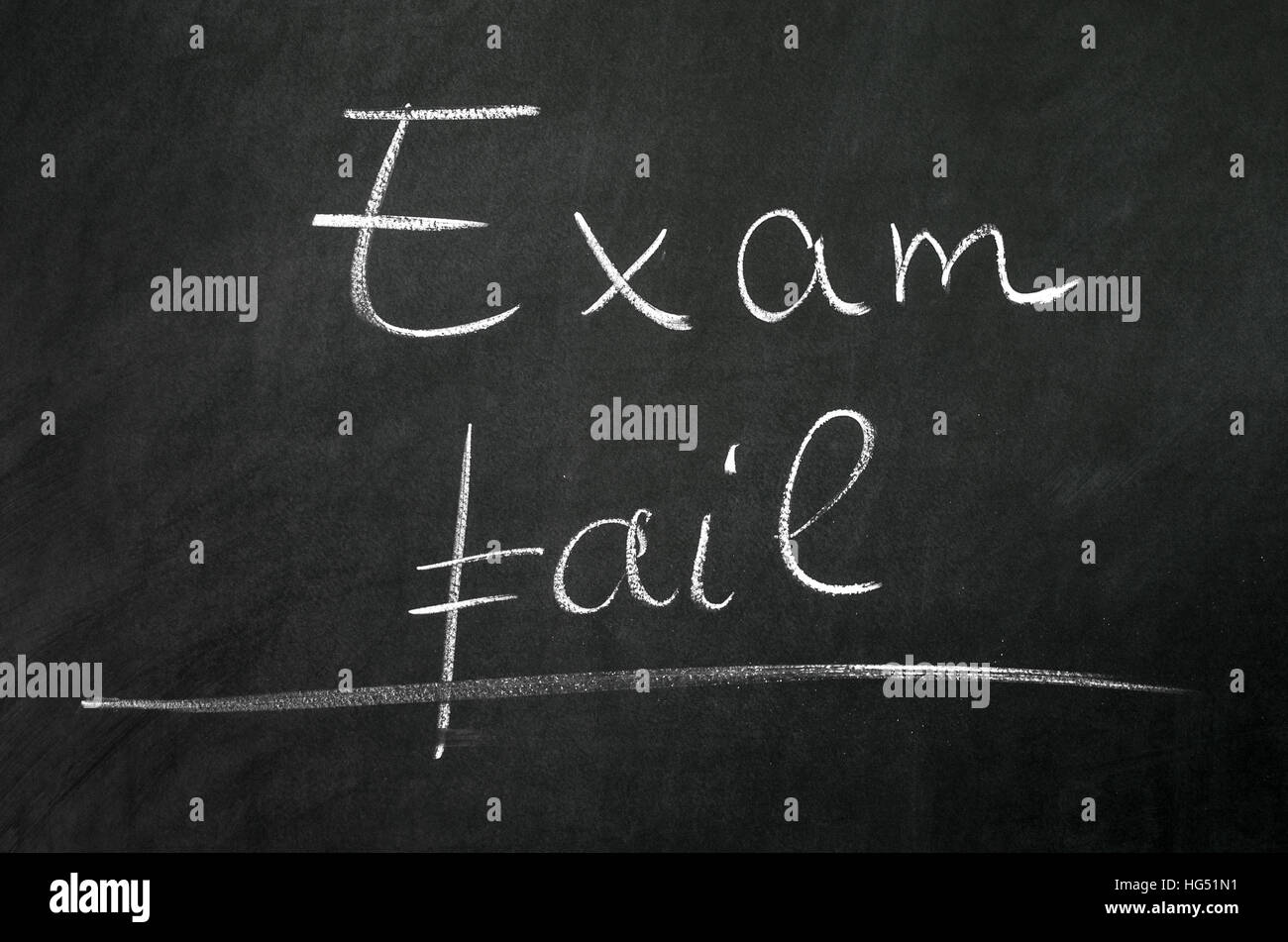 Exam fail writed on blackboard with chalk Stock Photo