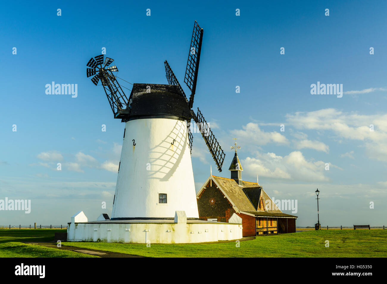 The Windmill and Old Lifeboat House iconic landmarks on the Green at Lytham Lancashire England Stock Photo