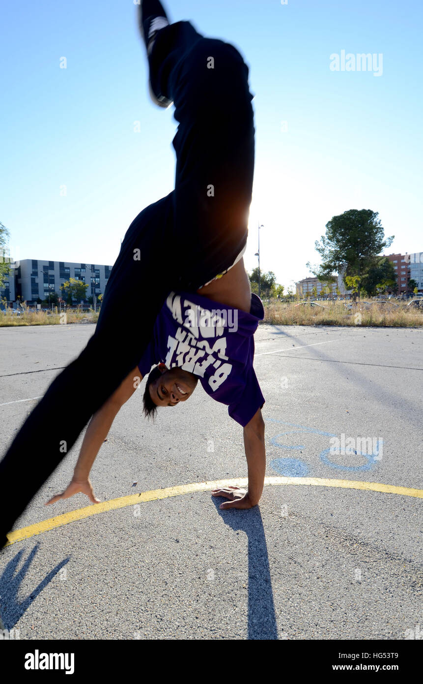 Breakdancer John Lartey performs in the street Stock Photo