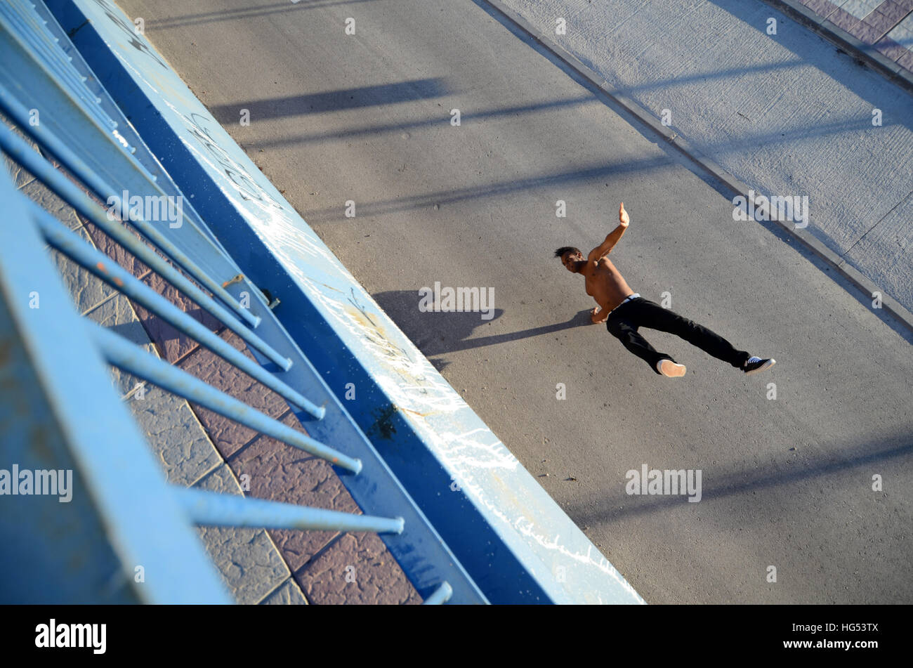 Breakdancer John Lartey performs in the street Stock Photo