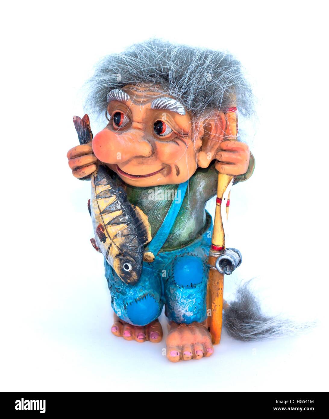 Fisher troll with fishing rod and fish figurine on a white