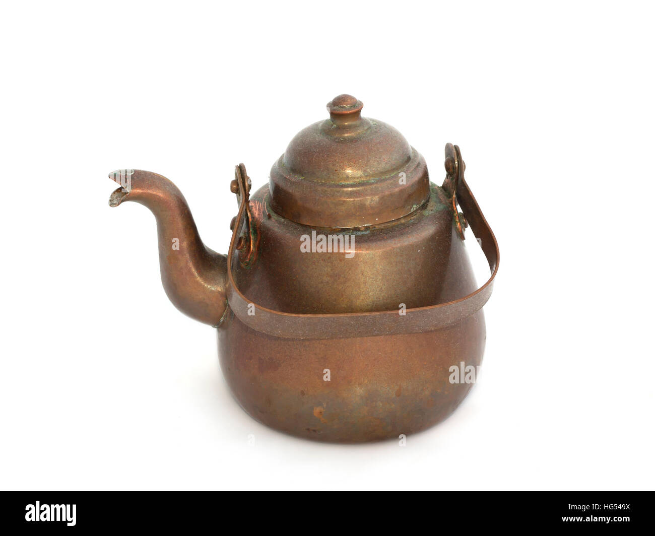 Old copper kettle on a white background Stock Photo