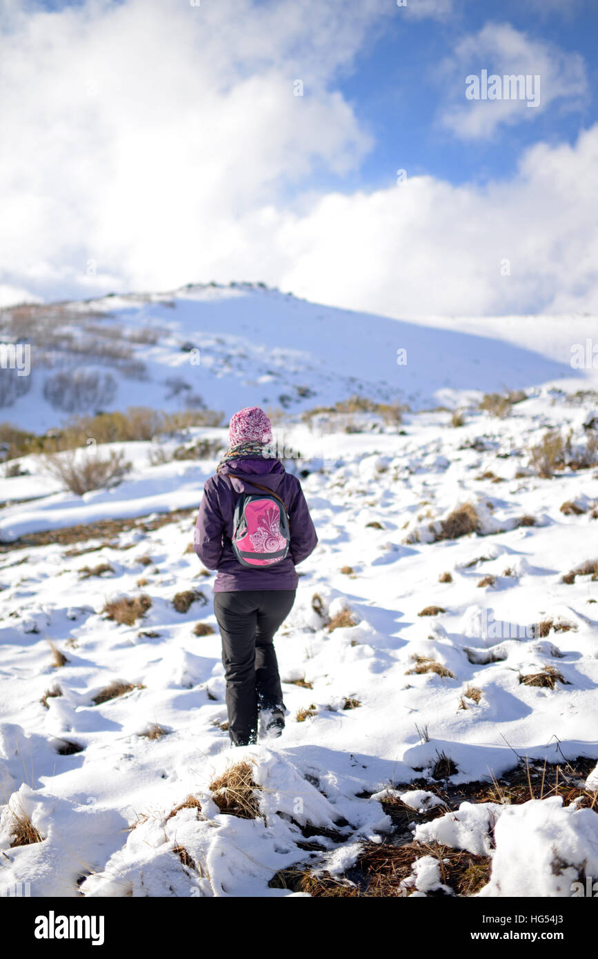Young woman hiking in snowy mountain Stock Photo - Alamy