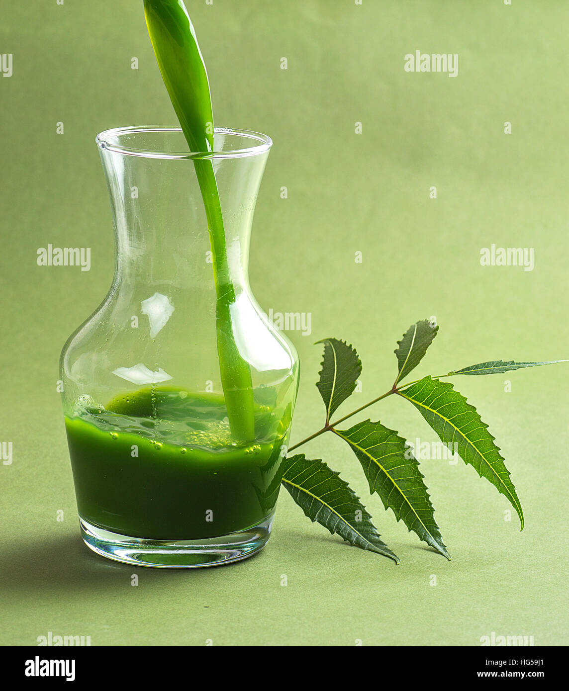 Medicinal Neem juice and leaves Stock Photo Alamy