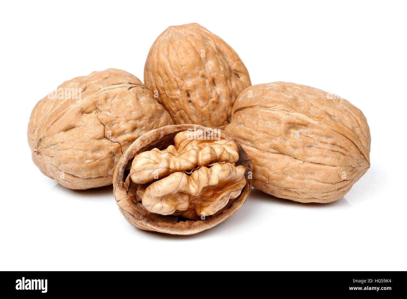 Whole walnut and half walnut piece Stock Photo Alamy