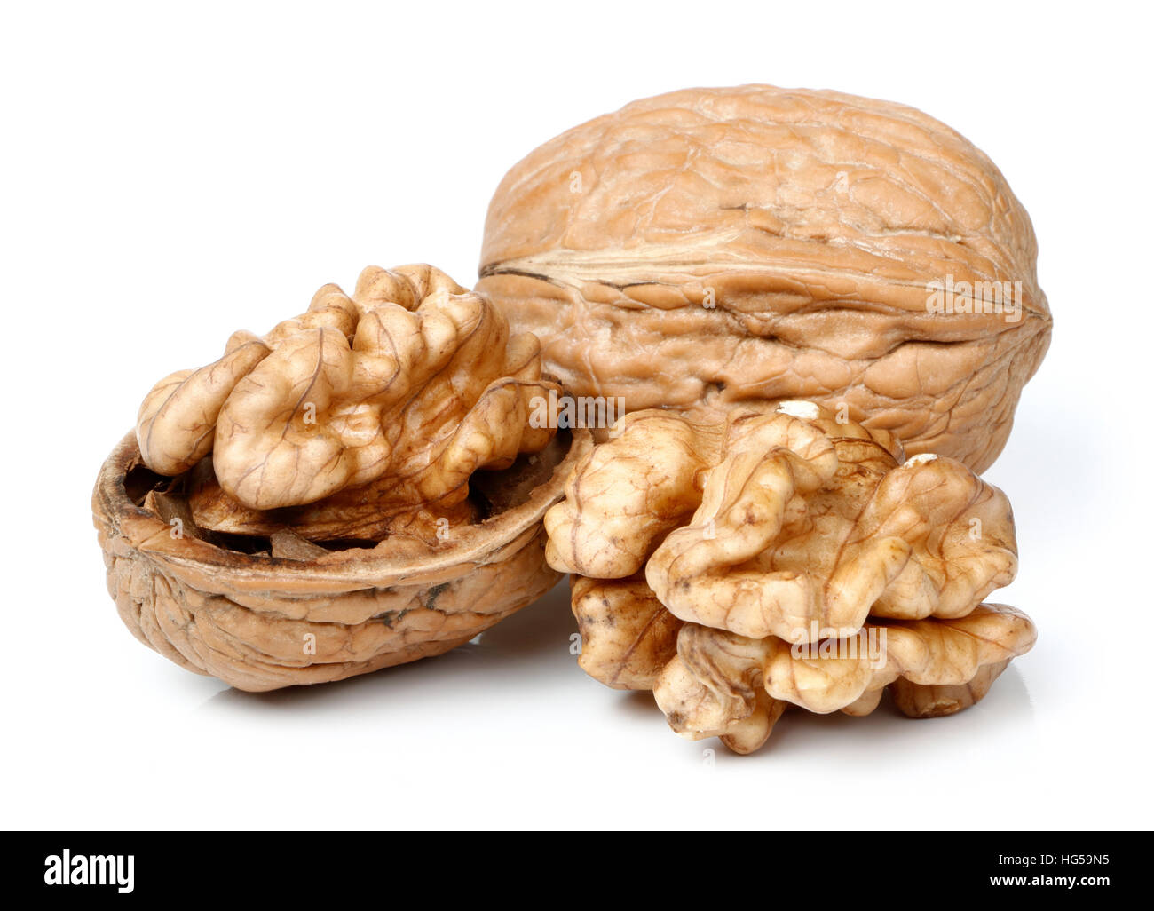 Walnut In Half Whole walnut and half walnut piece Stock Photo - Alamy