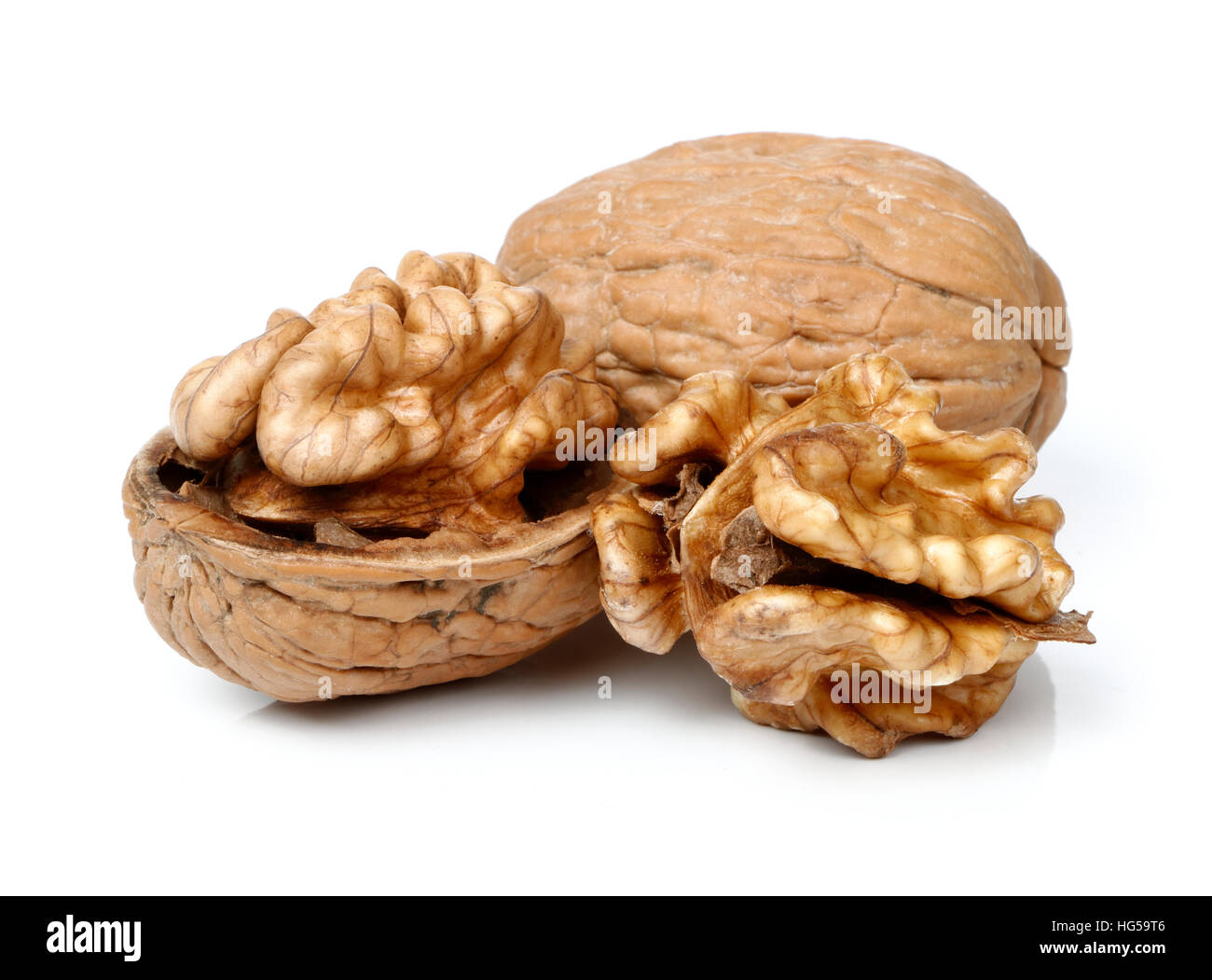 Whole walnut and half walnut piece Stock Photo Alamy
