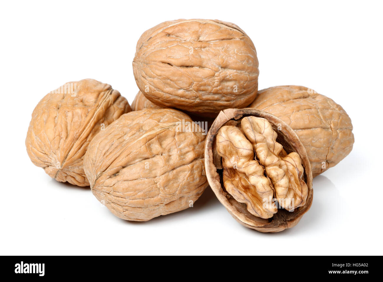 Whole walnut and half walnut piece Stock Photo Alamy