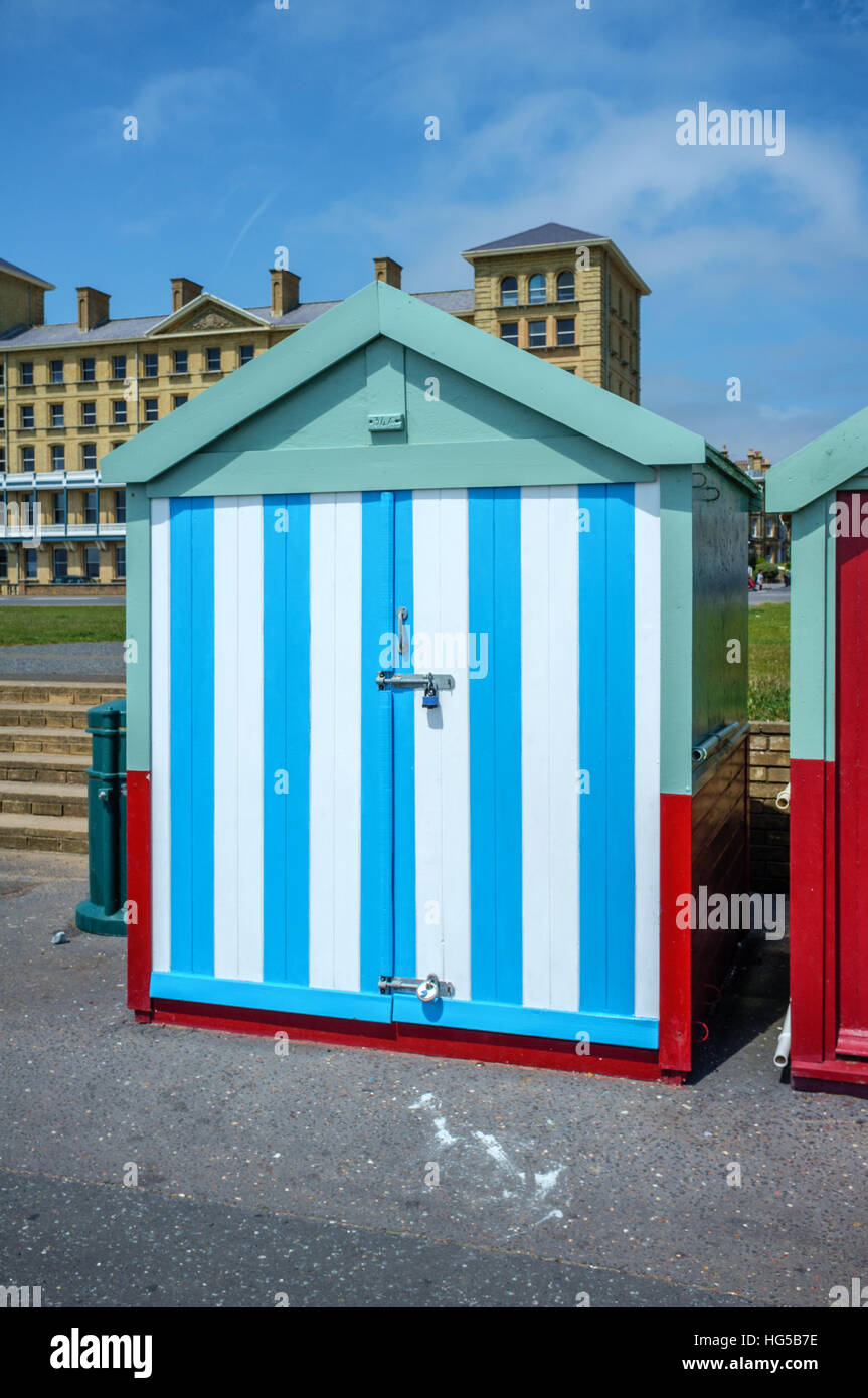 Colourful beach hut on Hove seafront in East Sussex, England, UK,  painted in the colours of Brighton and Hove football club. Stock Photo