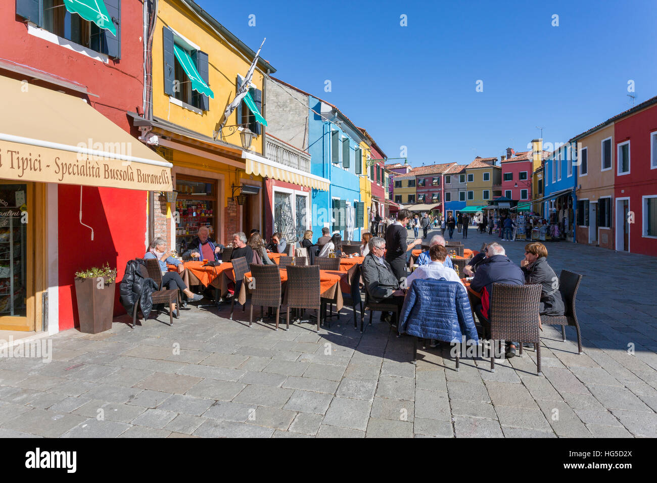 Restaurant and colourful facades, Burano, Veneto, Italy Stock Photo