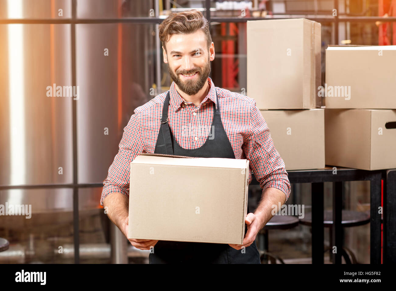 Professional courier with boxes Stock Photo Alamy