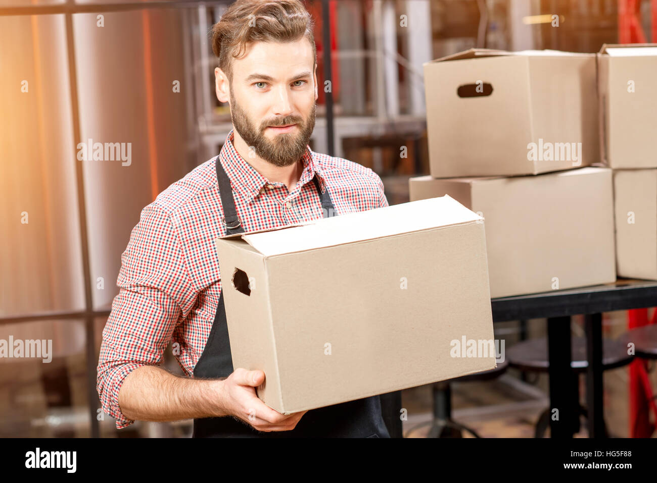 Professional courier with boxes Stock Photo Alamy