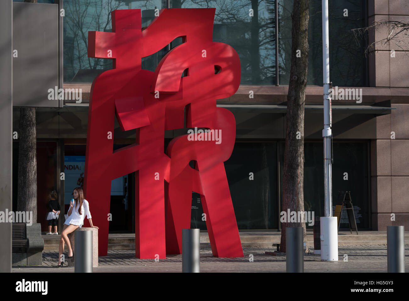 japanese art statue contemporary next to japanese girl Stock Photo