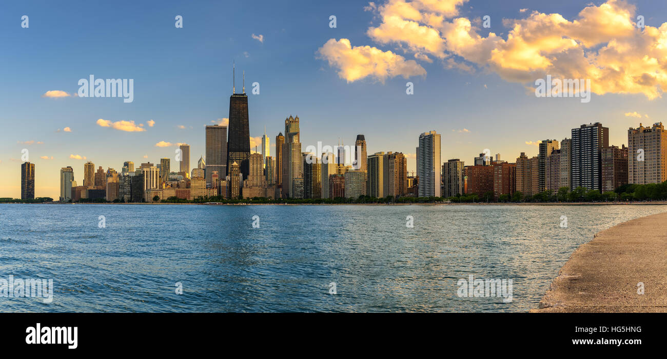 Chicago skyline panorama across Lake Michigan at sunset viewed from North Avenue Beach Stock Photo