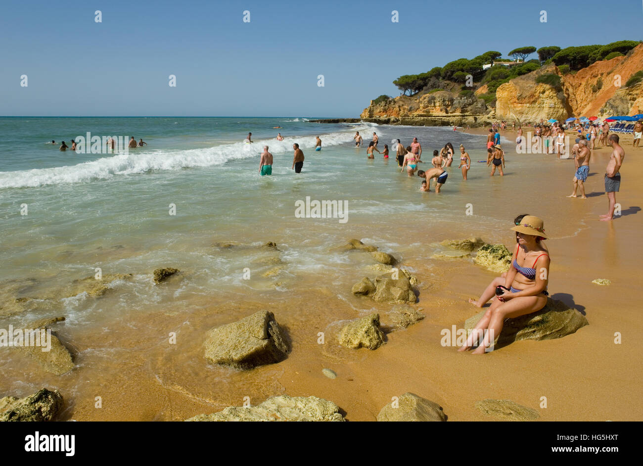 People at the famous beach of Olhos de Agua in Albufeira. Stock Photo