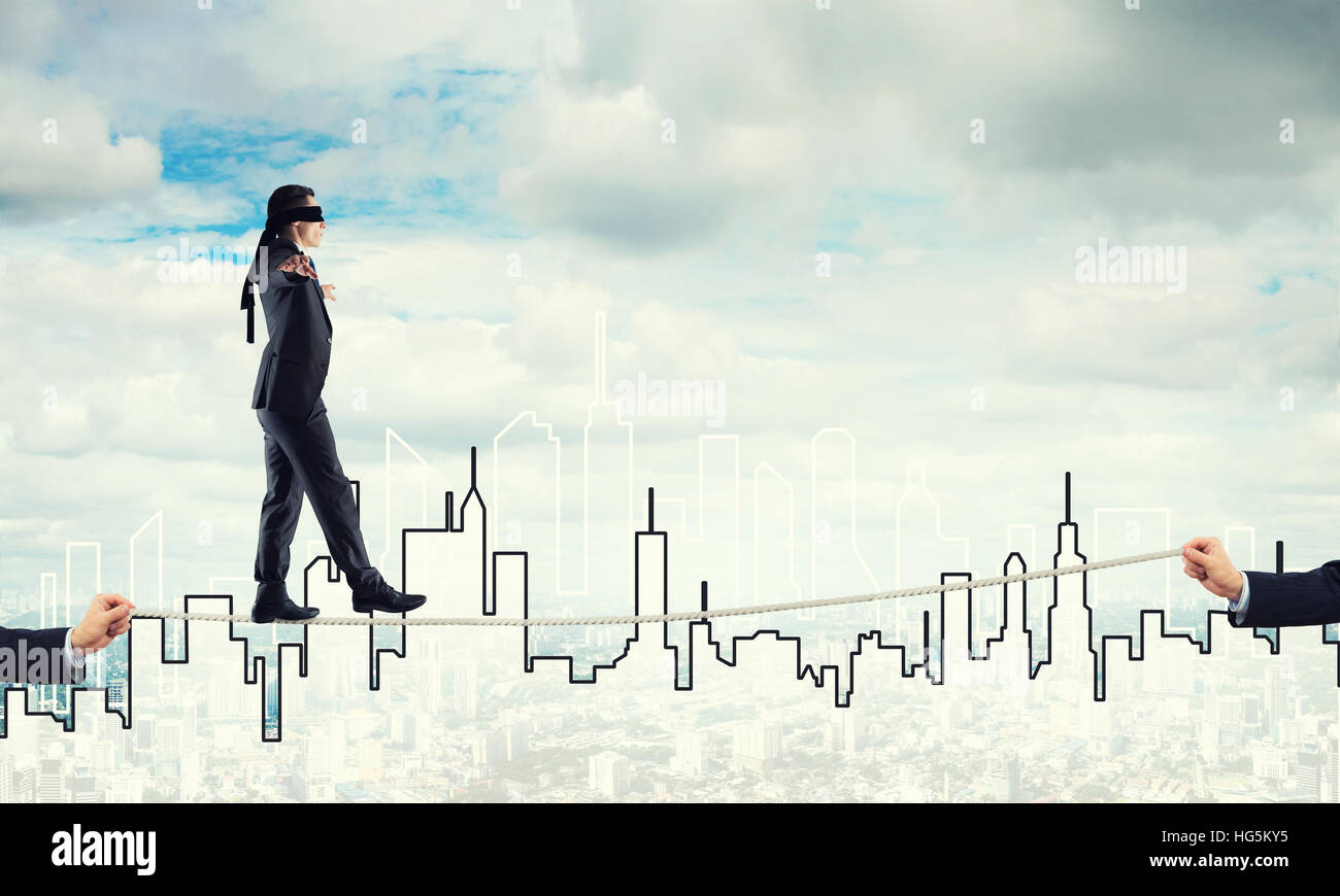 Helping Risk Business concept of risk support and assistance with man balancing on ...