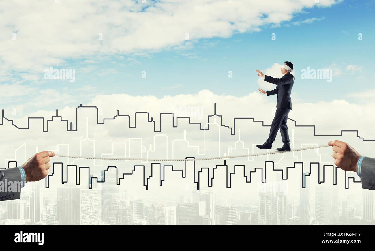 Business concept of risk support and assistance with man balancing on ...
