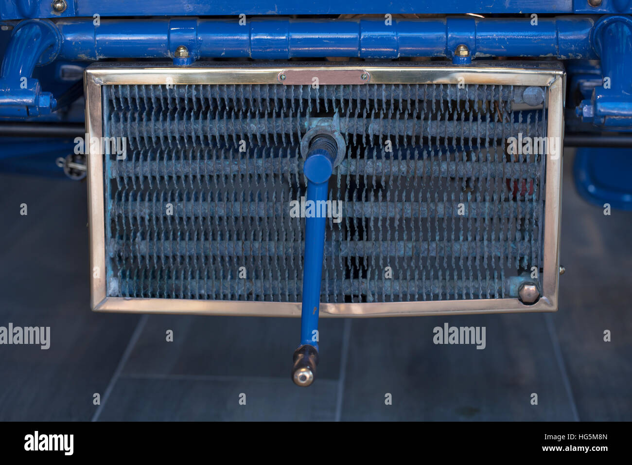 Vintage 1904 Vintage Automobile Starter Crank and Front Grill Stock